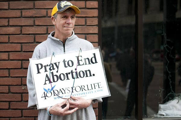 man holding sign